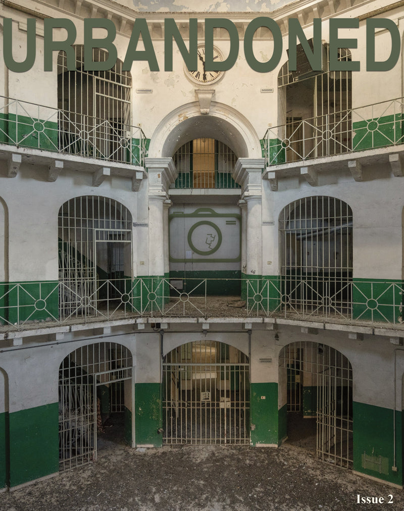 Front cover of Urbandoned Issue 2 showing three tiers of barred prison landings around a central clock